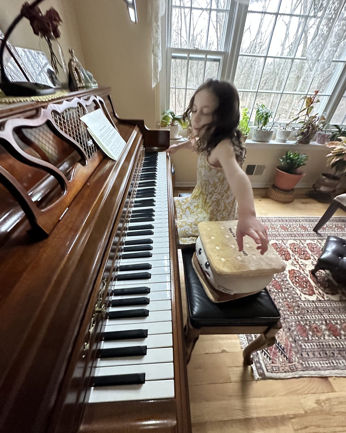 Child taking a piano lesson