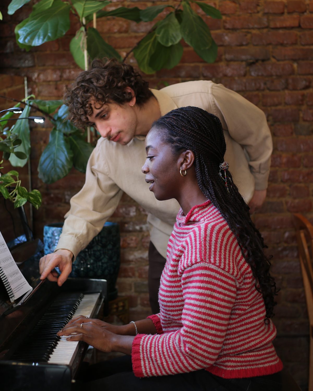 Jordan teaching a piano lesson
